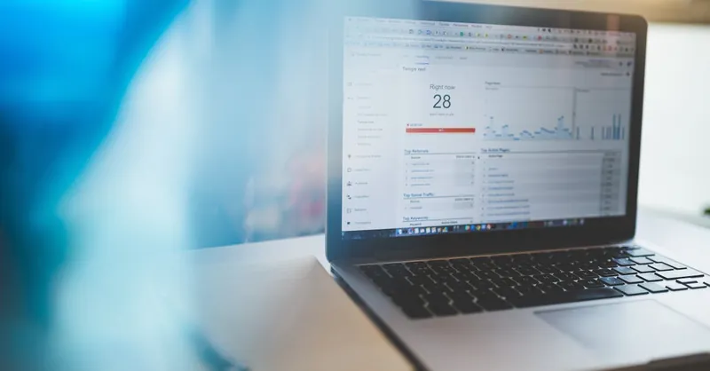 Laptop displaying Google Analytics in a modern workspace, highlighting digital analytics and technology.