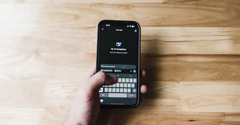 A person interacting with an AI assistant on a smartphone indoors.